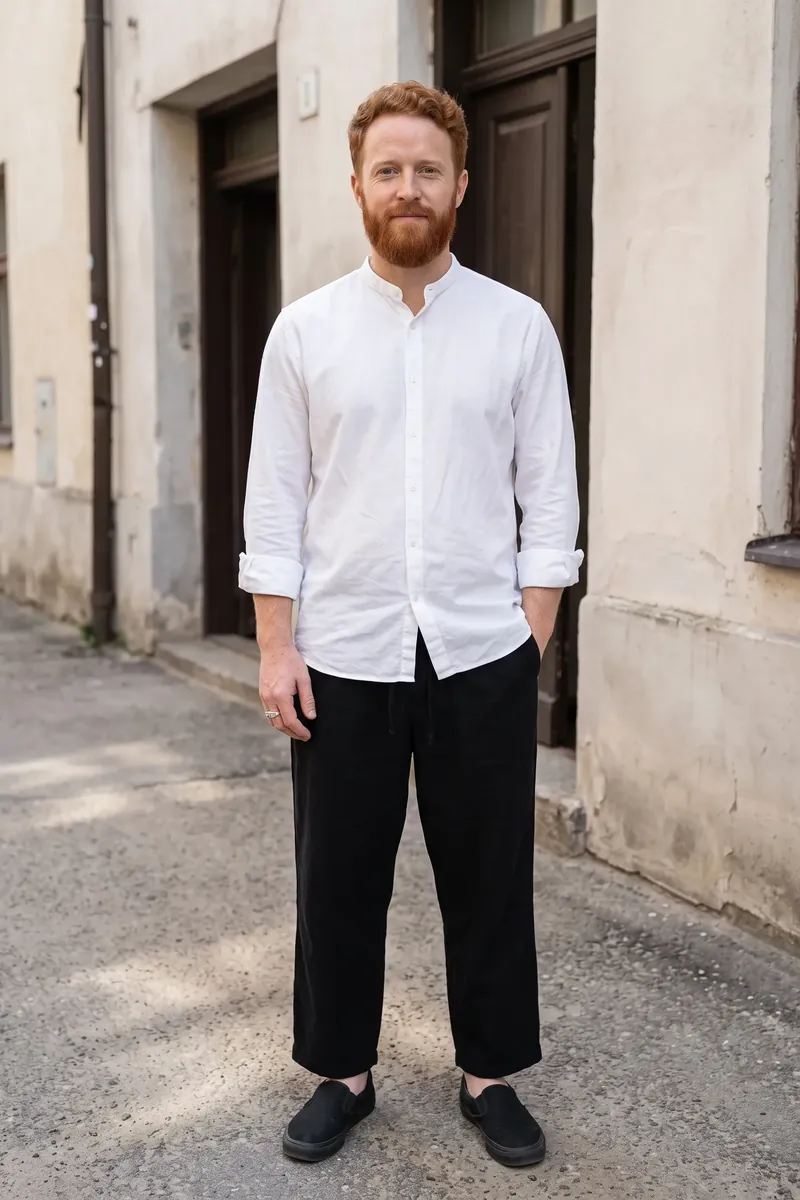 Look 01 on Lucas, a synthetic person: long white band-collar shirt worn untucked over wide black drawstring trousers